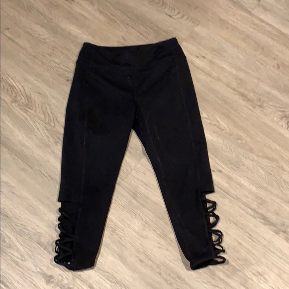 girls black capris with cross-cut pattern on calf